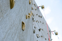 Outdoor Climbing Wall, An Artificially Constructed Wall With Grips For Hands And Feet.