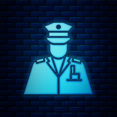 Wall Mural - Glowing neon Police officer icon isolated on brick wall background.  Vector Illustration