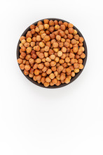 Raw Cleaned Hazelnuts In Round Bowl On White Background, Top View