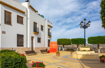 Poster - Streets of a white town called Lucainena de las Torres in Spain. Some flowers and balconies.