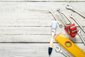 Tools on a wooden background. Place for text