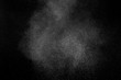 © sergio34 - Freeze motion of white particles on black background. Powder explosion. Abstract dust overlay texture.