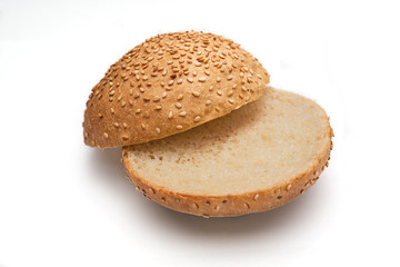 Fresh fragrant bun for burgers with sesame seeds on a white background. Can be used for advertising