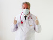 © Mariano - Portrait of Male Doctor apron with protective Medical mask and gloves thumbs up Gesture. Concept of Health Protection for Corona Virus COVID 19 Pandemic Outbreak Quarantine Epidemic Lockdown Hygiene