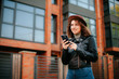 © Катя Іваськевич - young woman with mobile phone in the city. coronavirus. covid-19.