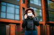 © Катя Іваськевич - young woman  in the city in mask. coronavirus. covid-19.