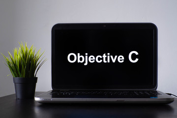 Wall Mural - objective c programming language. programming training, the concept of computer courses. laptop on t