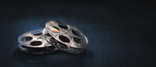 3D Rendering Of Movie Reels On A Dark Blue Surface