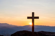 © AungMyo - Silhouettes of crucifix symbol with bright sunbeam on the colorful sky background