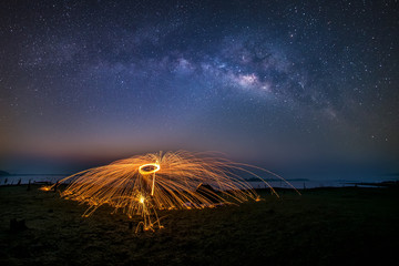 Wall Mural - milky way galaxy, on the mountains above the dam. long exposure photograph, with grain.image contain