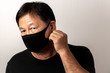 © Nachpapon - Close-up face of a  Asian man wearing a mask