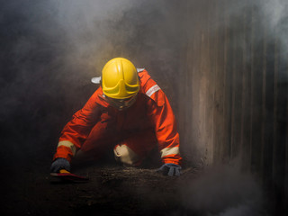 Poster - firefighter spray water to fire burning car workshop fire training