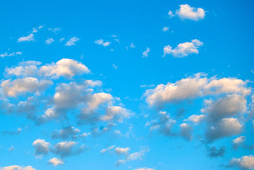 White beautiful clouds on a background of blue sky. Beautiful background.