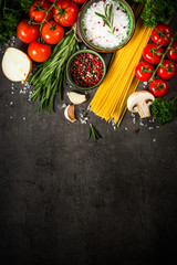 Food cooking background on black kitchen table.