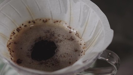 Wall Mural - Coffee Drip Concept. Pouring Hot Water from Kettle into a Drpper. Making Hot Coffee Drink in House. Zen and Cozy Living. Top View