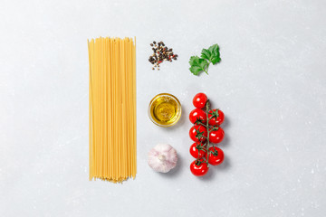 Wall Mural - Ingredients for cooking traditional Italian pasta on white grey background