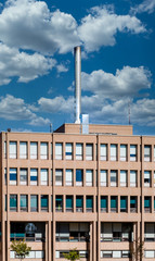 Sticker - Metal Smokestack on Brown Building under blue sky