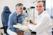 © lightpoet - Optometry concept - pretty young woman having her eyes examined by an eye doctor