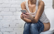 © Prostock-studio - Woman With Smartphone Playing Mobile Games Sitting On Toilet, Cropped