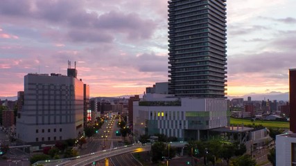 Poster - Kumamoto, Japan. Aerial view of a train station and skyscrapers in a popular touristic city of Kyushu island Kumamoto, Japan in the morning. Time-lapse at sunrise, panning video