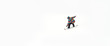 © guruXOX - Freerider snowboarder rolls and rides his snowboard on extreme gradient downhill. Winter mountain freeride. Space place for text