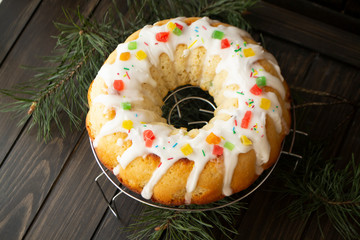 Traditional yeast cake covered with white icing and raisins Spongy yeast cake that is traditionally baked for Easter. Top view