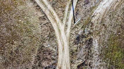 Cross between two dirt roads in the open countryside