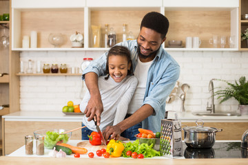 Wall Mural - Vegan family cooking healthy food together at home