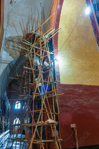 Fotografía Myanmar Travel Images, Bamboo scaffolding inside Asian building for carrying out restoration work
