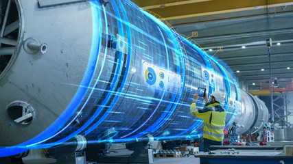 Wall Mural - AR Concept: Industrial Engineer Uses Augmented Reality Digital Tablet to Scan Large Metal Construction, Special Effects Show Visualization / Digitalization of Oil, Gas and Fuel Transport Pipeline.