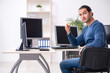 © Elnur - Young male it specialist working in the office