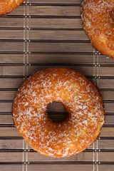 Polish donut,traditional sweet donuts on black background. Delicious, but unhealthy food on the old wooden table with copy space