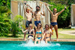 © yurakrasil - group of six friends having fun in swimmingpool outdoors
