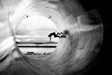 Person Skateboarding In Tunnel