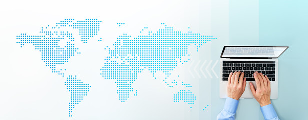 Aufkleber - Laptop and world map. World business and internet. Top view of businessman using laptop.