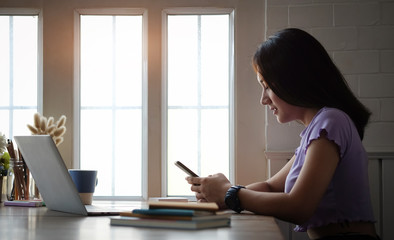 Business women work from home living room enjoying sunny morning on the day with documents and laptop people Consulting and business planning. 