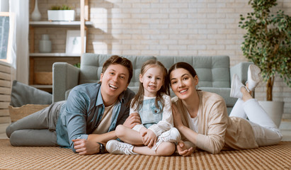 Wall Mural -  Child with mother and father.