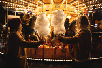 Wall Mural - A cotton candy in front of an ancient German Horse Carousel built in 1896 in Navona Square, Rome, Italy