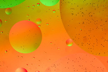 Abstract Green And Orange Water Bubbles Background