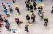 App scanning and tracking blurred people for Coronavirus prevention in city center - Software against Covid-19 outbreak - Big data, privacy, immune, healthy and infected concept - Defocused photo