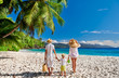 © haveseen - Family with three year old boy on beach. Seychelles, Mahe.