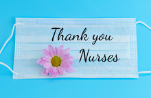 Protective Facial Medical Mask With A Flower On A Blue Background And Text Thank You Nurses Who Are Frontline Workers During The Coronavirus Pandemic