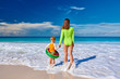 © haveseen - Toddler boy on beach with mother