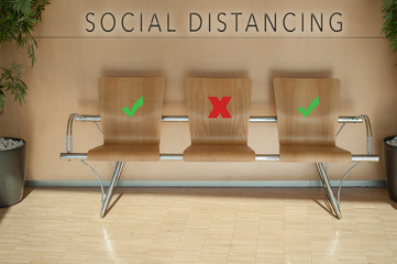 Brown chair alignment in a waiting room with symbol on seat for the social distancing during the Covid-19 pandemic