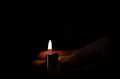 © eologm - flame of a lighter with a hand