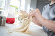 © Daisy Daisy - Close Up Of Portrait Of Girl With Messy Hands Having Fun In Kitchen Kneading Dough For Baking