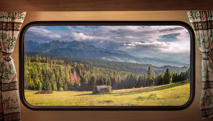 Wall Mural - Green valley at sunset in Tatras, view from camper window