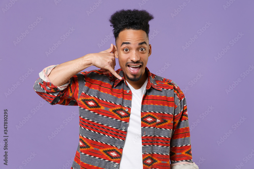 Excited young african american guy in casual colorful shirt posing ...