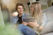 © goodluz - Young couple doing e-shopping on internet with tablet