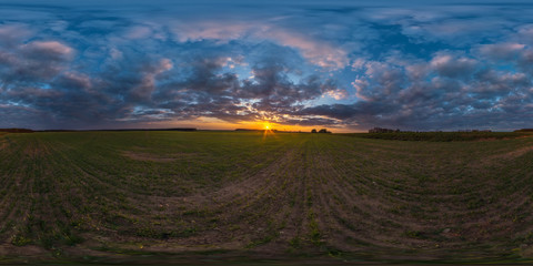 Wall Mural - full seamless spherical hdri panorama 360 degrees angle view among fields in summer evening sunset with awesome blue orange red clouds in equirectangular projection, ready for VR AR virtual reality
